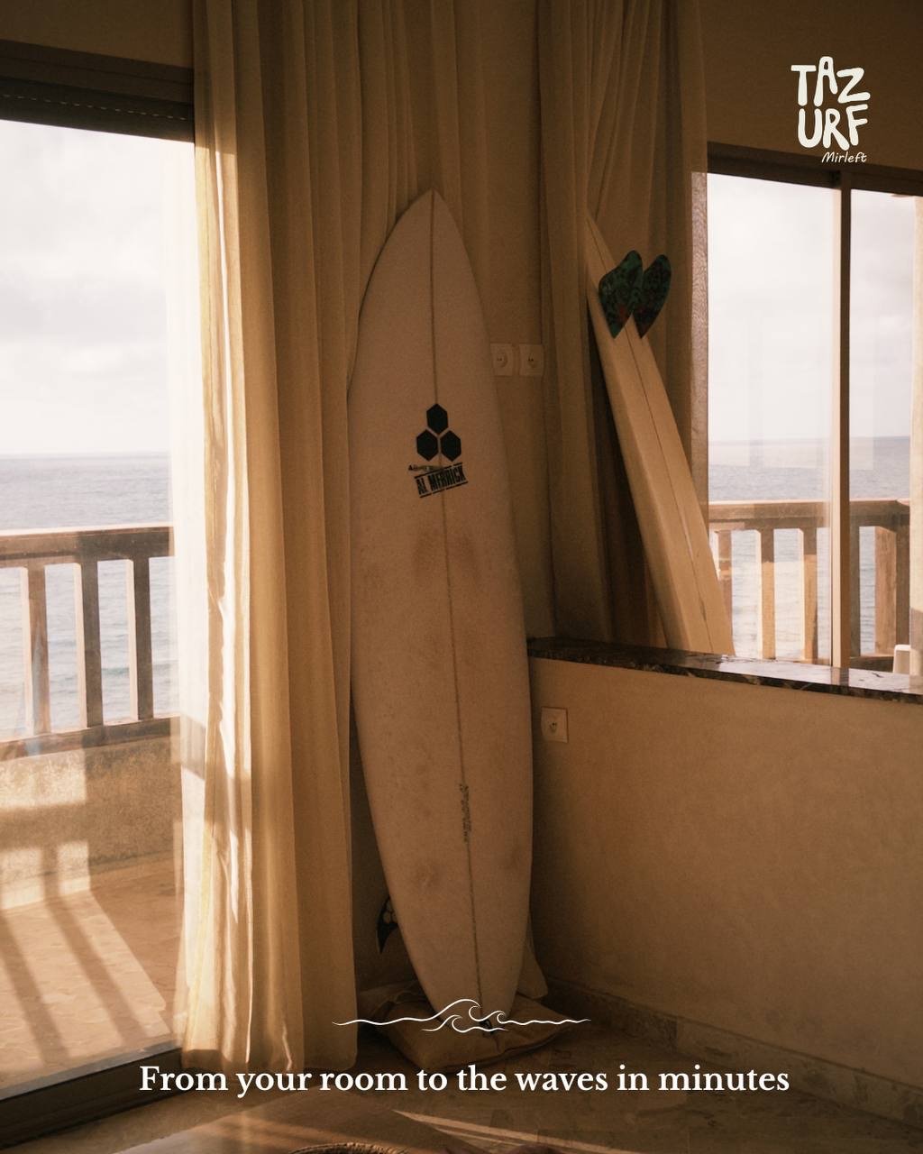 Surfboards on the balcony with ocean view