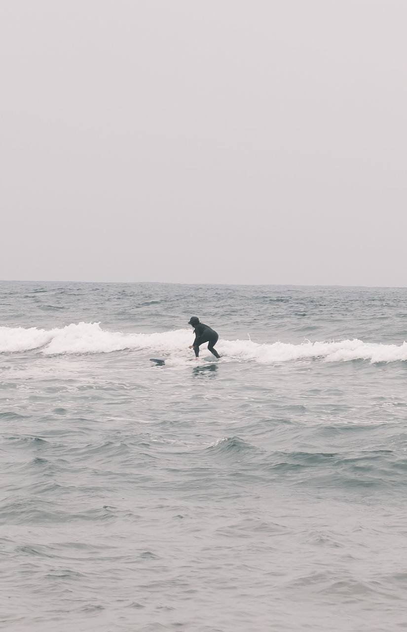 Surfer riding a wave in Mirleft